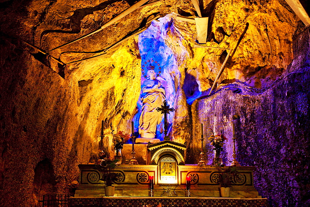 Statue of a saint in a holy cave, Santuario di Santa Rosalia, Monte Pellegrino, Palermo, Sicily, Italy