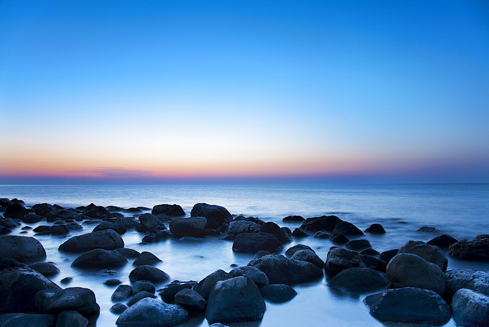 Rocks in sea at night, CefalË™, Palermo, Sicily, Italy