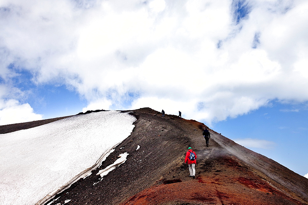 Hikers mounitng Etna, Sicily, Italy