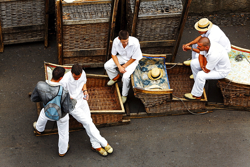 Wicker basket toboggans with their guides, sledges in Monte, Funchal, Madeira, Portugal