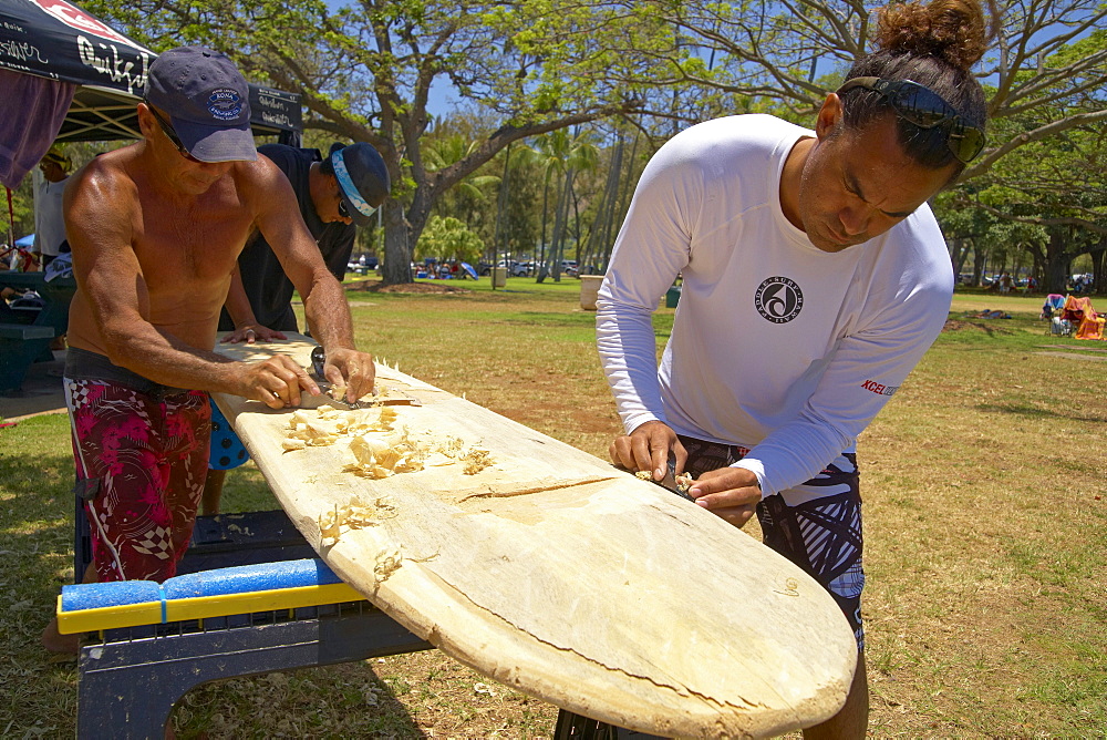 Local people making a traditional surfboard, Waikiki Beach, Honolulu, Oahu, Hawaii, USA, America