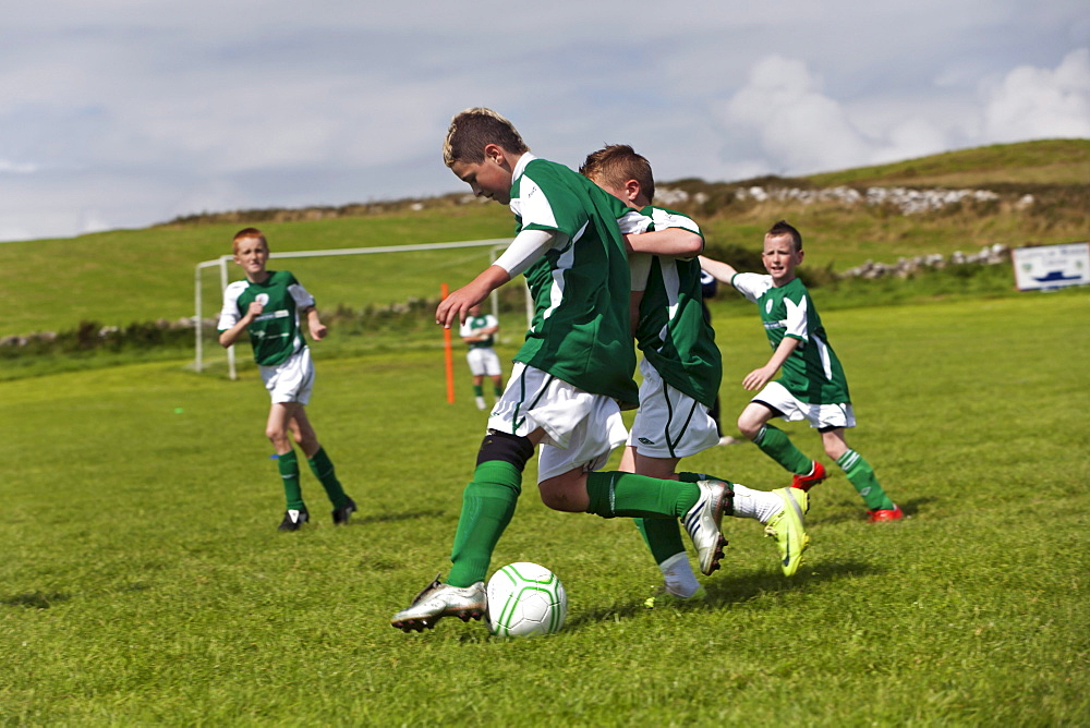 Young boys playing football, County Clare