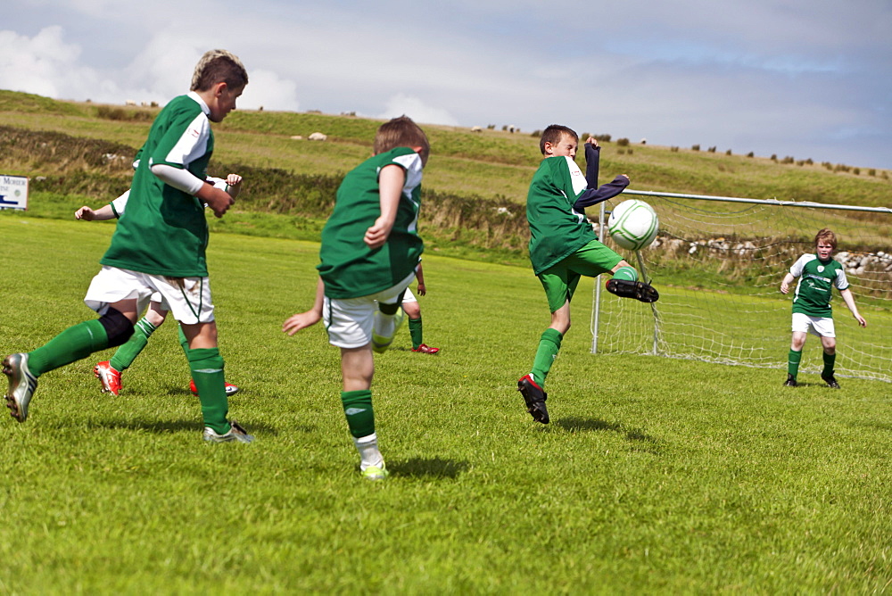 Young boys playing football, County Clare