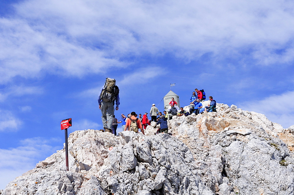 Mountaineers at Triglav summit, Triglav, Triglav national park, Julian alps, Slovenia