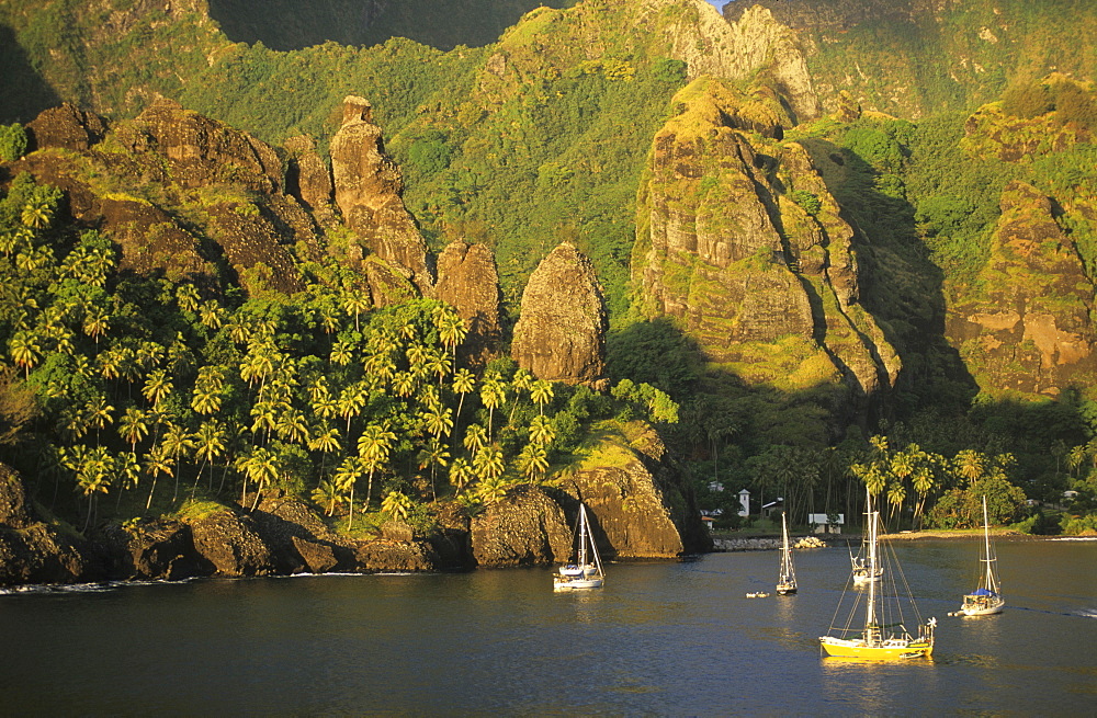 Sailing boats in the Bay of Hanavave on the island of Fatu Iva, French Polynesia