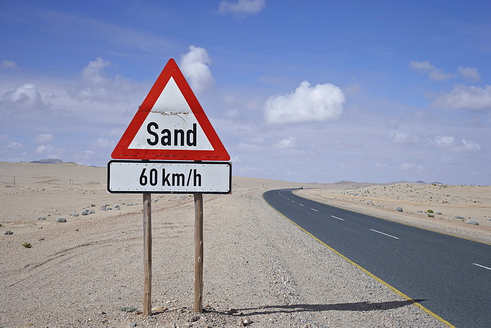 Warning sign on the roadside in the desert, Namibia, Africa