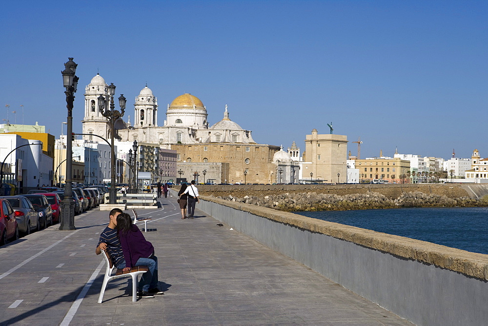 People on Campo del Sur promenade and Cadiz Cathedral, Cadiz, Andalucia, Spain, Europe