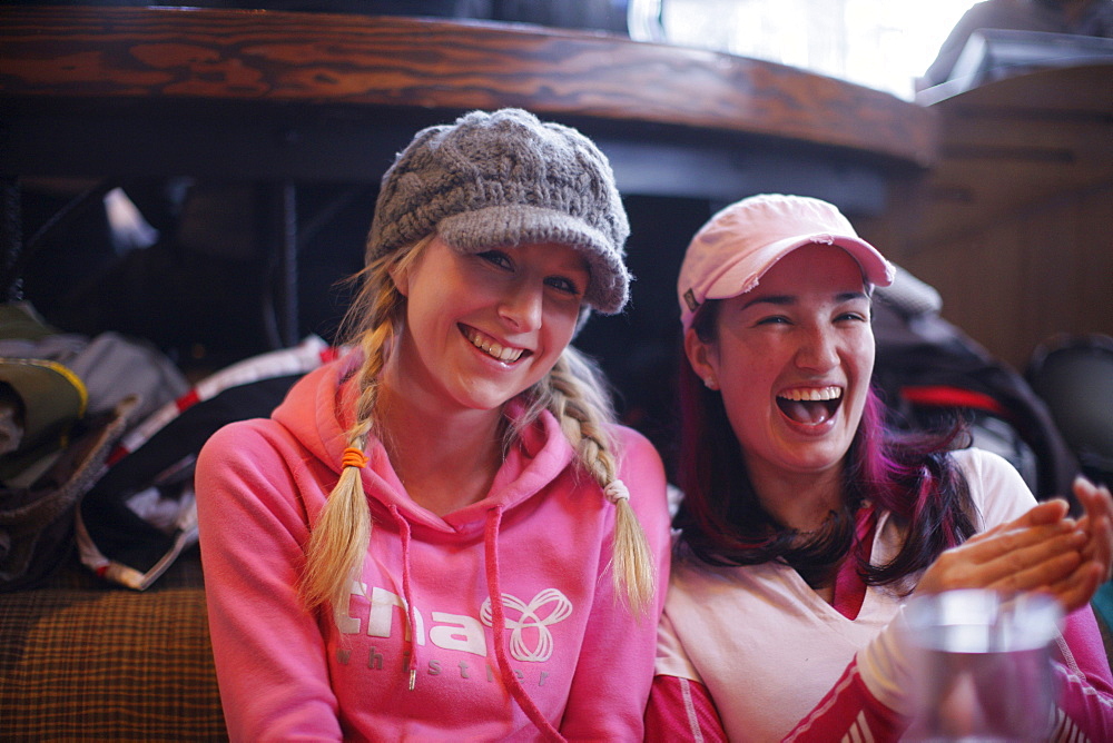 Two women laughing, Apres-ski bar, Whistler, British Columbia, Canada