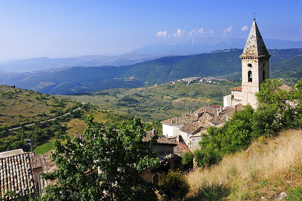 Sunlit church at mountain village, Rocca Calascio, Gran Sasso National Park, Abruzzi, Italy, Europe