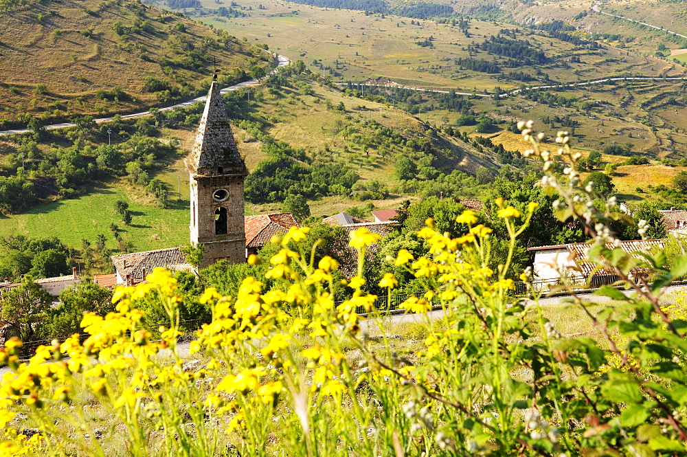 Sunlit church at mountain village, Rocca Calascio, Gran Sasso National Park, Abruzzi, Italy, Europe