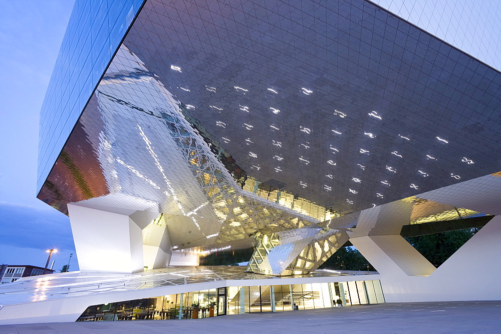 Porsche Museum in Stuttgart-Zuffenhausen in the evening, designed by the architects Delugan Meissl Associated Architects in cooperation with HG Merz, Stuttgart, Baden-Wuerttemberg, Germany, Europe