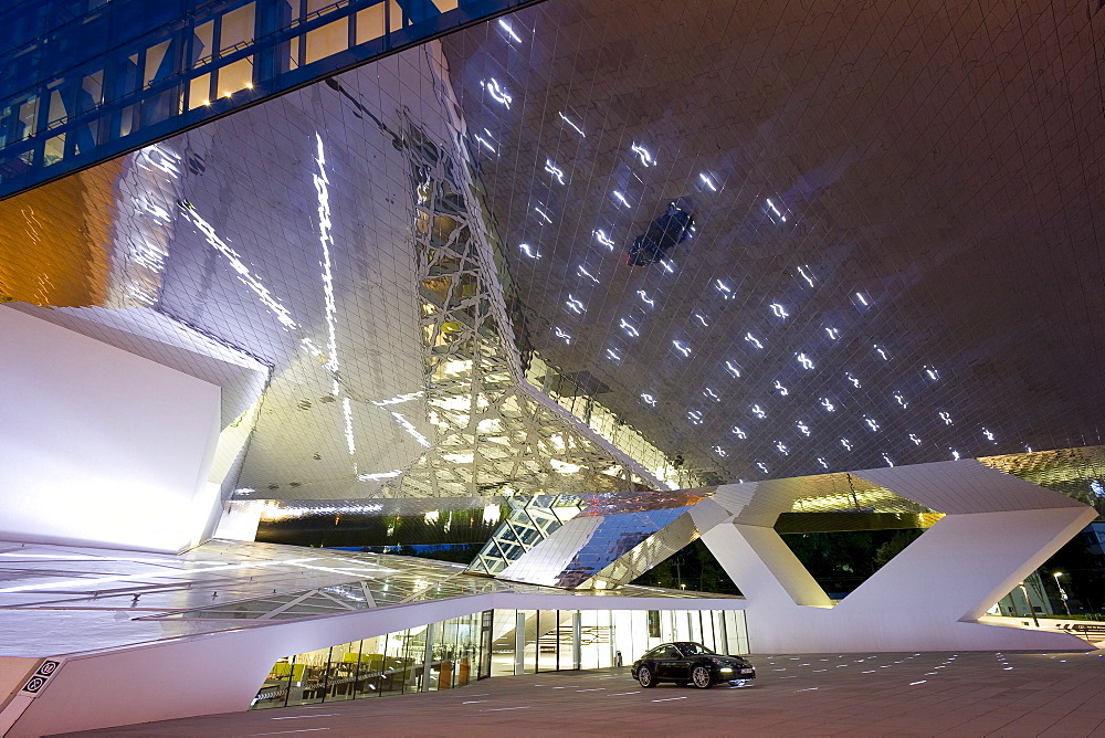 Porsche Museum in Stuttgart-Zuffenhausen in the evening, designed by the architects Delugan Meissl Associated Architects in cooperation with HG Merz, Stuttgart, Baden-Wuerttemberg, Germany, Europe