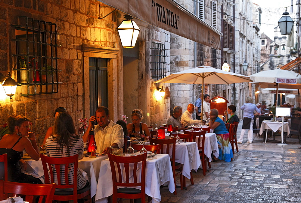 Pavement restaurants in old town in the evening, Dubrovnik, Dubrovnik-Neretva county, Dolmatia, Croatia