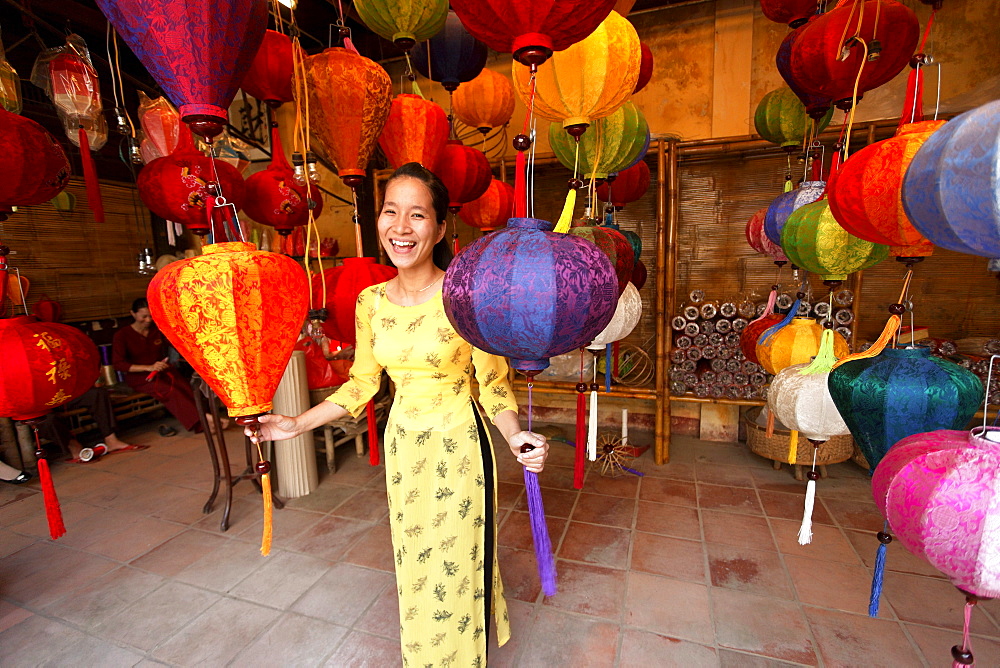 Woman inside a lampion store, Hoi An, Annma, Vietnam