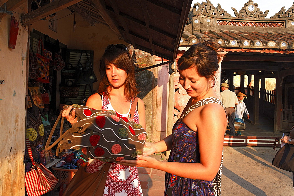 Two women shopping, Chua Cau, Japanese Bridge, Hoi An, Annam, Vietnam