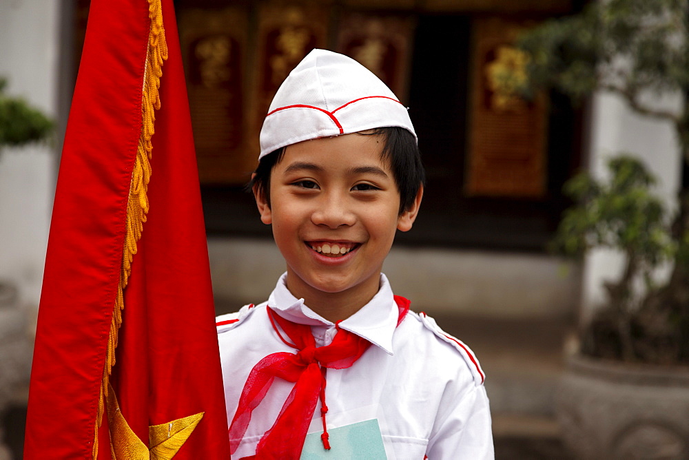 Pupil holding a flag, Temple of Literature (Van Mieu), Hanoi, Bac Bo, Vietnam