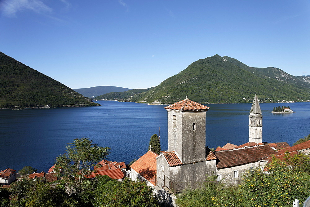 View of Sveti Nikola church with bell tower, in the background Gospa od Skrpjela island, Perast, Bay of Kotor, Montenegro, Europe