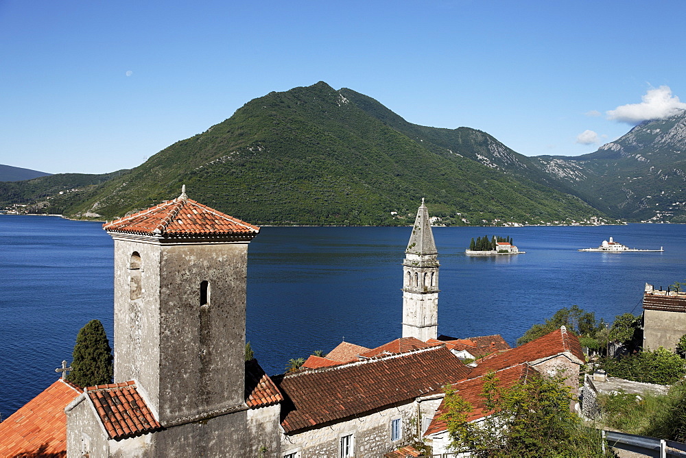 View of Sveti Nikola church with bell tower, in the background Gospa od Skrpjela island and Sveti Dorde island, Perast, Bay of Kotor, Montenegro, Europe