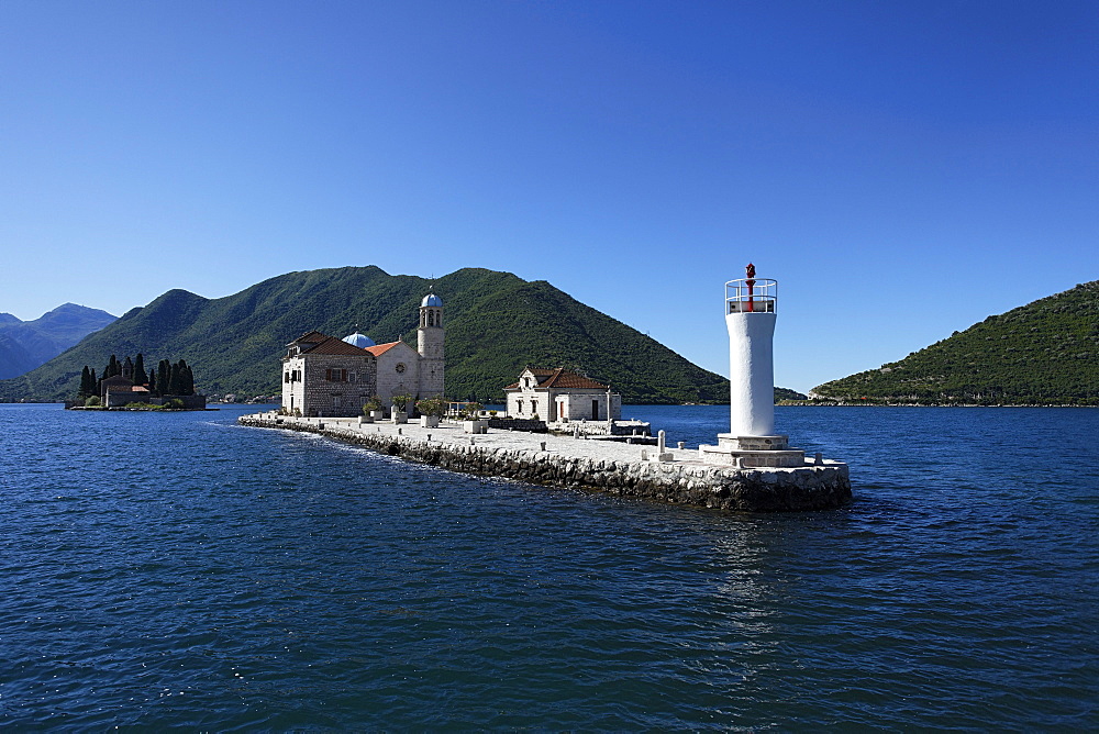 Church on the Island of Gospa od Skrpjela in the sunlight, Perast, Bay of Kotor, Montenegro, Europe