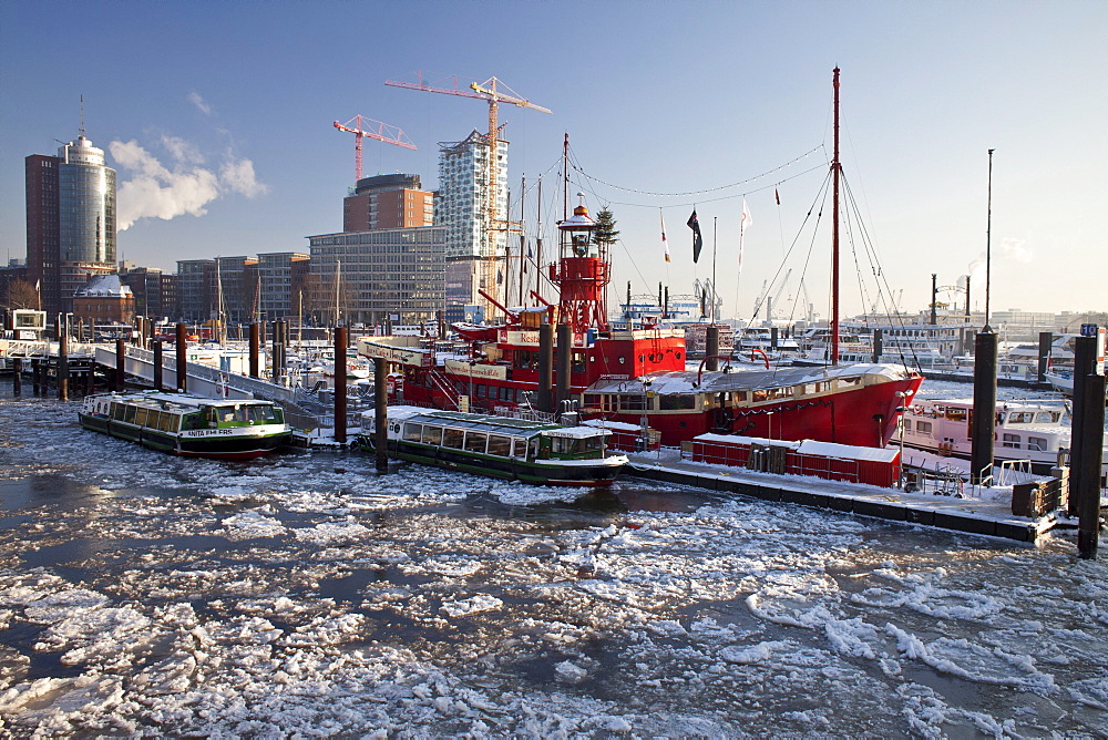 Fire ship in front of HTC Hanseatic Trade Center and Elbphilharmonie in winter, the Free and Hanseatic City of Hamburg, Germany, Europe