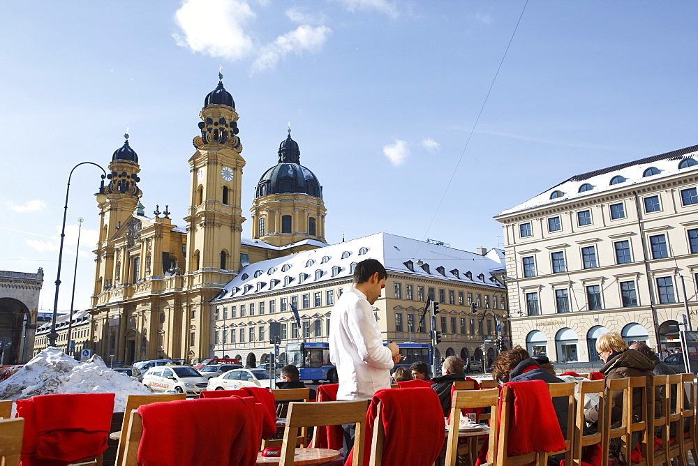 Odeonsplatz with pavement cafe and Theatine Church in winter, Munich, Bavaria, Germany