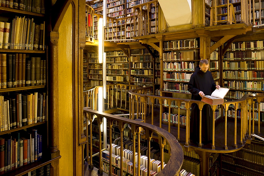 Monk at the library at Maria Laach abbey, Eifel, Rhineland-Palatinate, Germany, Europe