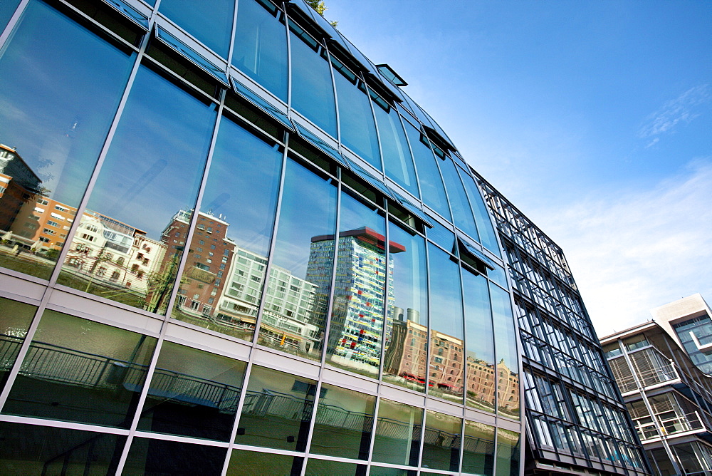 Reflection on glass facade, Media Harbour, Duesseldorf, Duesseldorf, North Rhine-Westphalia, Germany, Europe