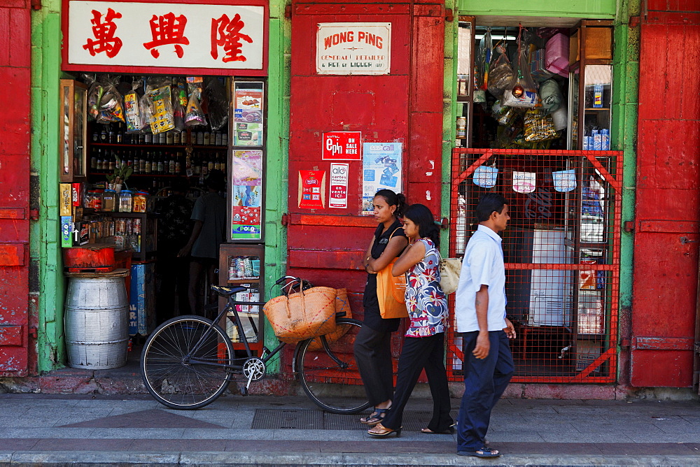 Street scene, people in front of a shop at rue de la Reine, Port Louis, Mauritius, Africa