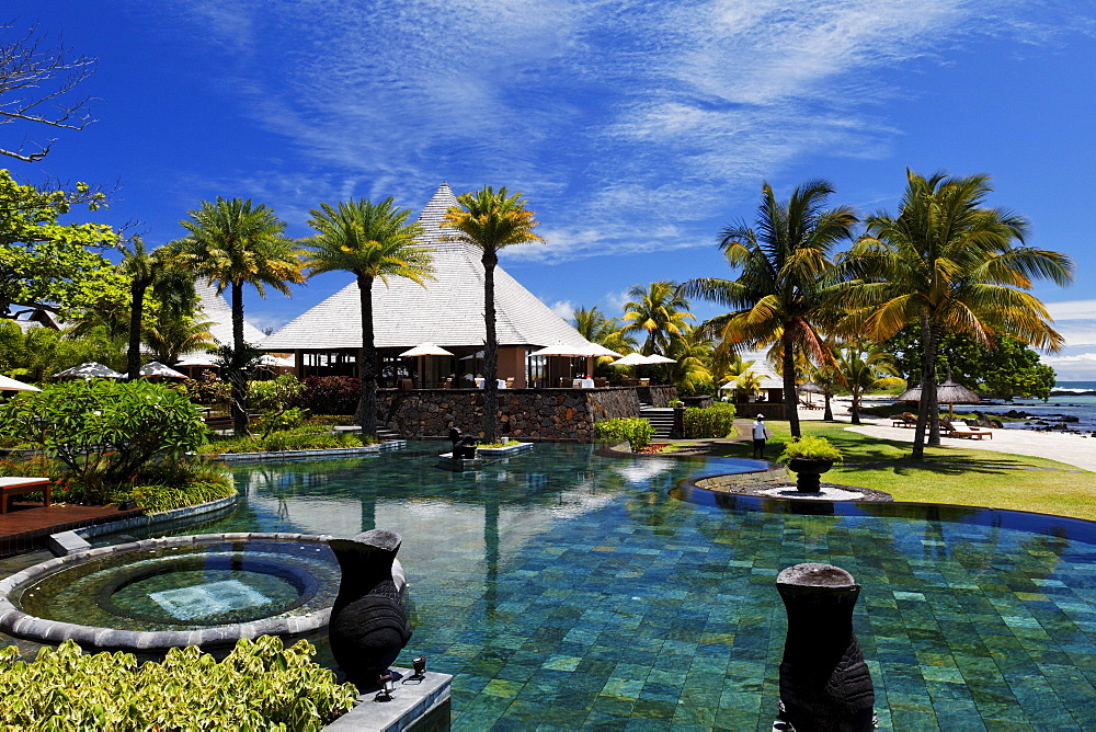 Pool and restaurant of the Shanti Maurice Resort in the sunlight, Souillac, Mauritius, Africa