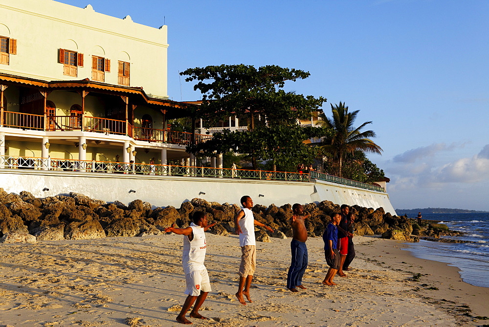 Children doing beach gymnastics in front of the Serena Inn hotel, Stonetown, Zanzibar City, Zanzibar, Tanzania, Africa