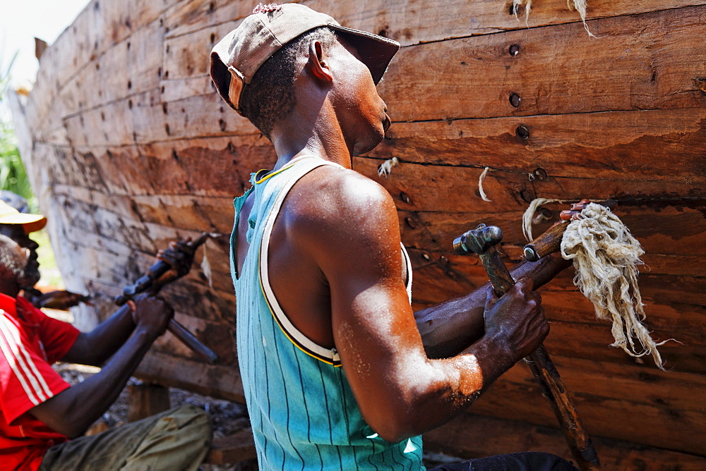 Workers at Dhow construction company in the village Nungwi, Zanzibar, Tanzania, Africa