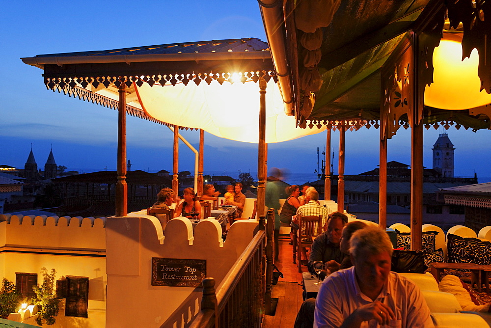 People on the roof terrace of the Hurumzi hotel in the evening, Stonetown, Zanzibar City, Zanzibar, Tanzania, Africa