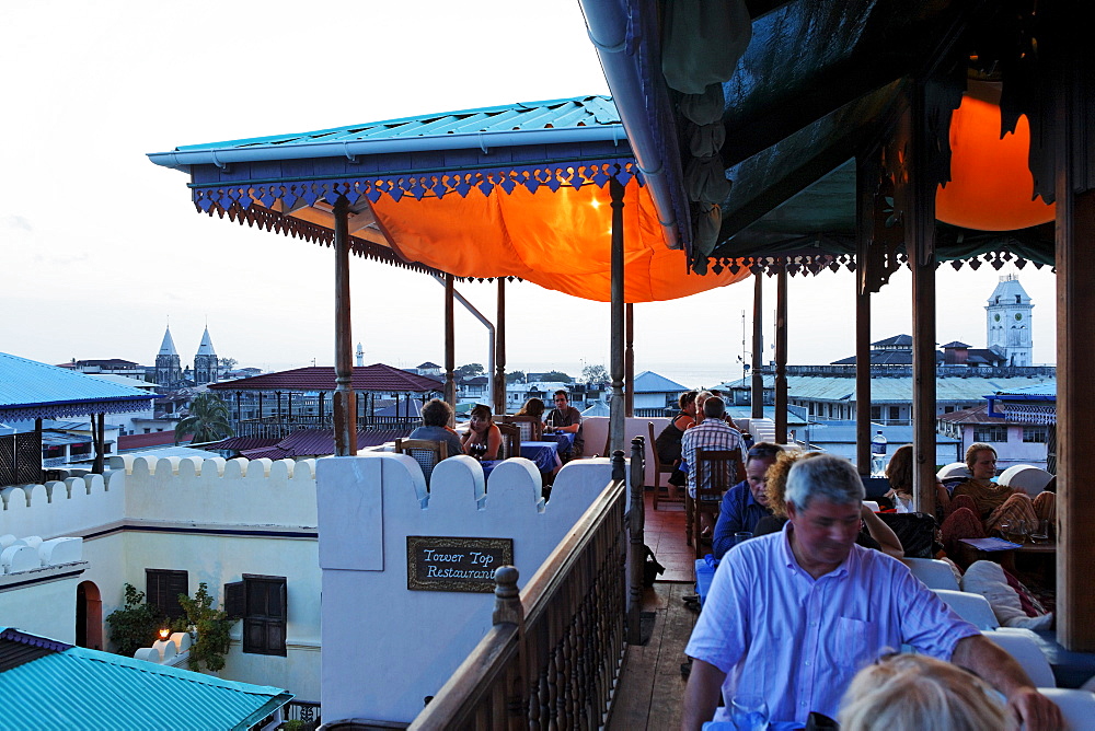 People on the roof terrace of the Hurumzi hotel in the evening, Stonetown, Zanzibar City, Zanzibar, Tanzania, Africa