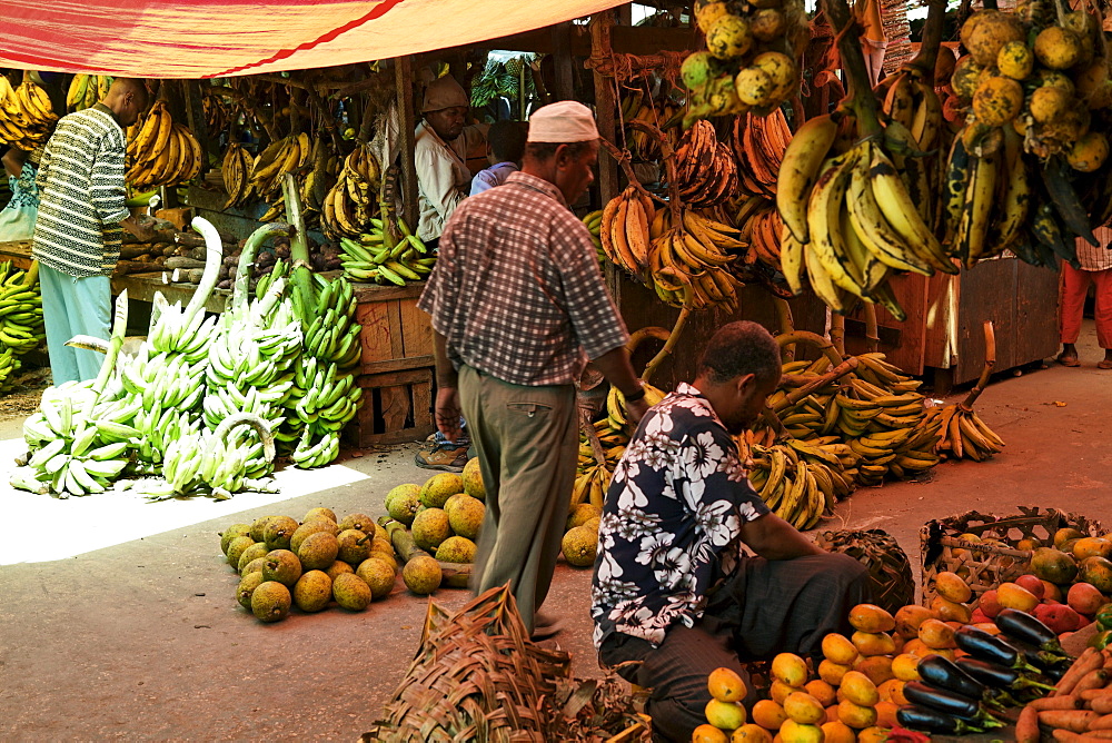 People at fruit stand at Darajani Market, Stonetown, Zanzibar City, Zanzibar, Tanzania, Africa