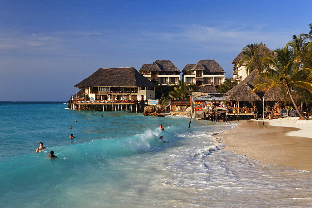 Bathing people in front of the Z Hotel in Nungwi, Zanzibar, Tanzania, Africa