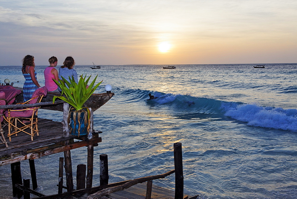 People on the terrace of the Z Hotel at sunset, Nungwi, Zanzibar, Tanzania, Africa