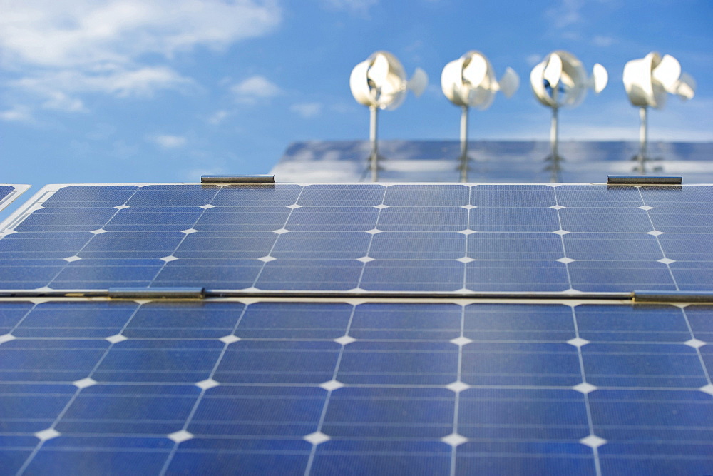 Small wind turbines and solar installations on the roof of Hotel Victoria, Freiburg im Breisgau, Baden-Wuerttemberg, Germany, Europe