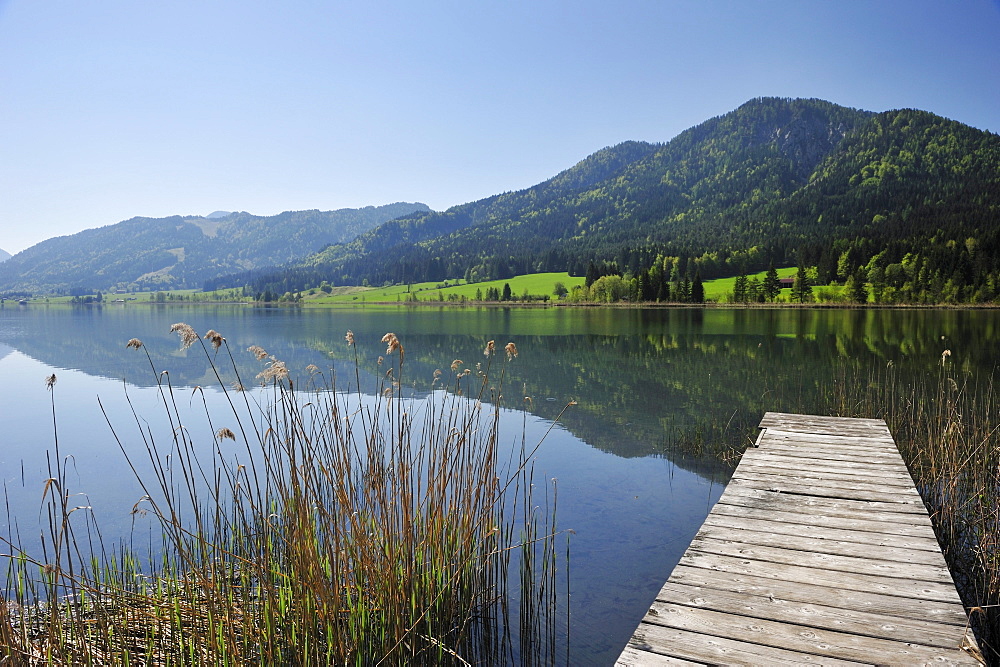 Wooden landing stage leading into lake Weissensee, Carinthia, Austria, Europe