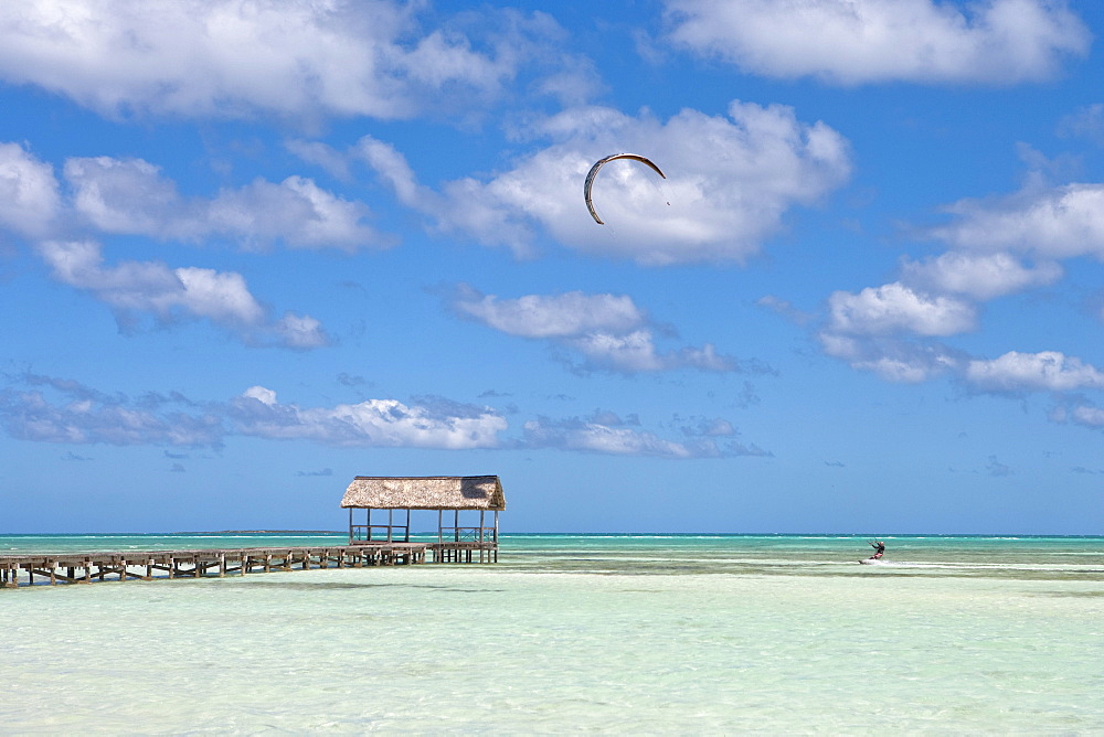 Pier and kitesurfer in lagoon, Cayo Guillermo (Jardines del Rey), Ciego de Avila, Cuba