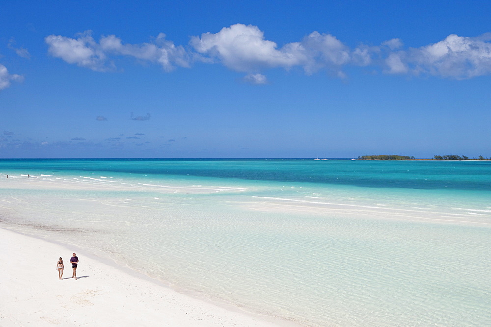 People strolling along Playa Pilar beach with Cayo Media Luna in the distance, Cayo Guillermo (Jardines del Rey), Ciego de Avila, Cuba