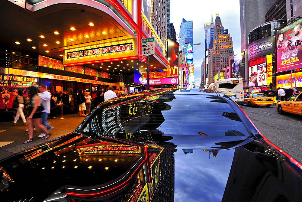 Reflection on the surface of black car, Times Square, Manhattan, New York City, USA