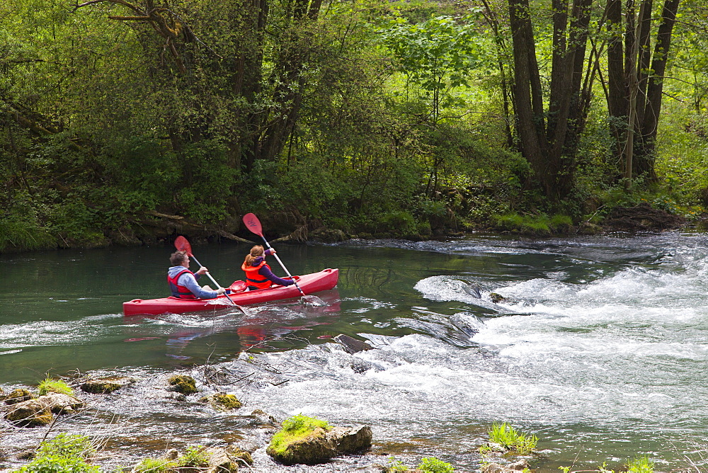 People canoeing at Wiesent valley, Fraenkische Schweiz, Franconia, Bavaria, Germany, Europe