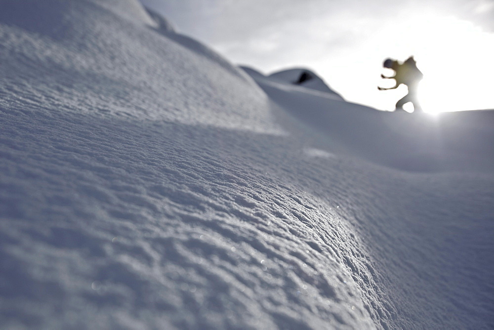 Snowboarder ascending, Chandolin, Anniviers, Valais, Switzerland