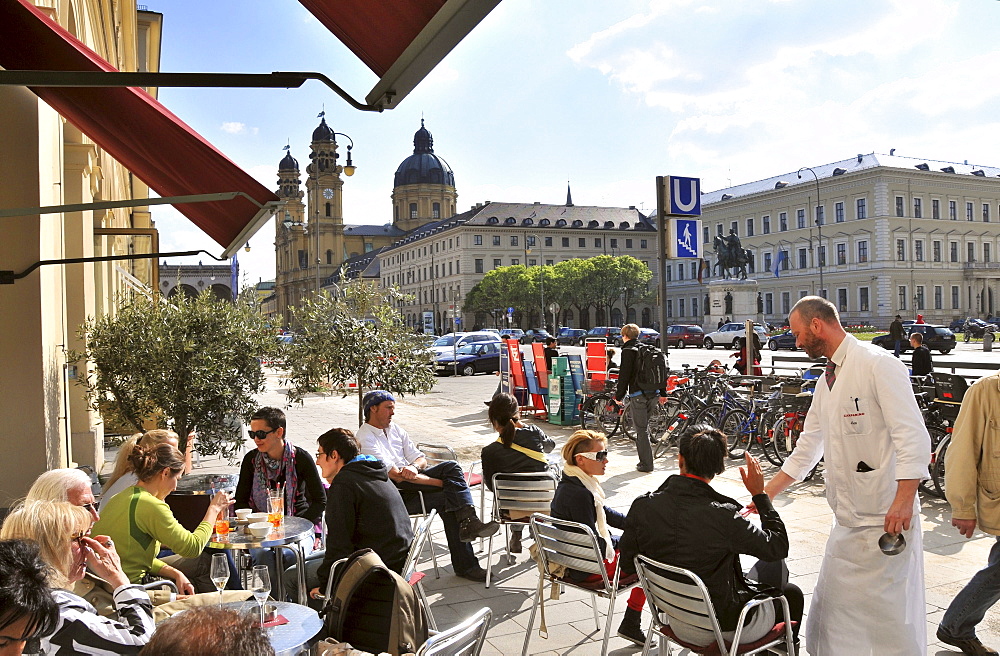 People at Cafe Schumann at Ludwigsstrasse with Theatiner church, Munich, Bavaria, Germany, Europe