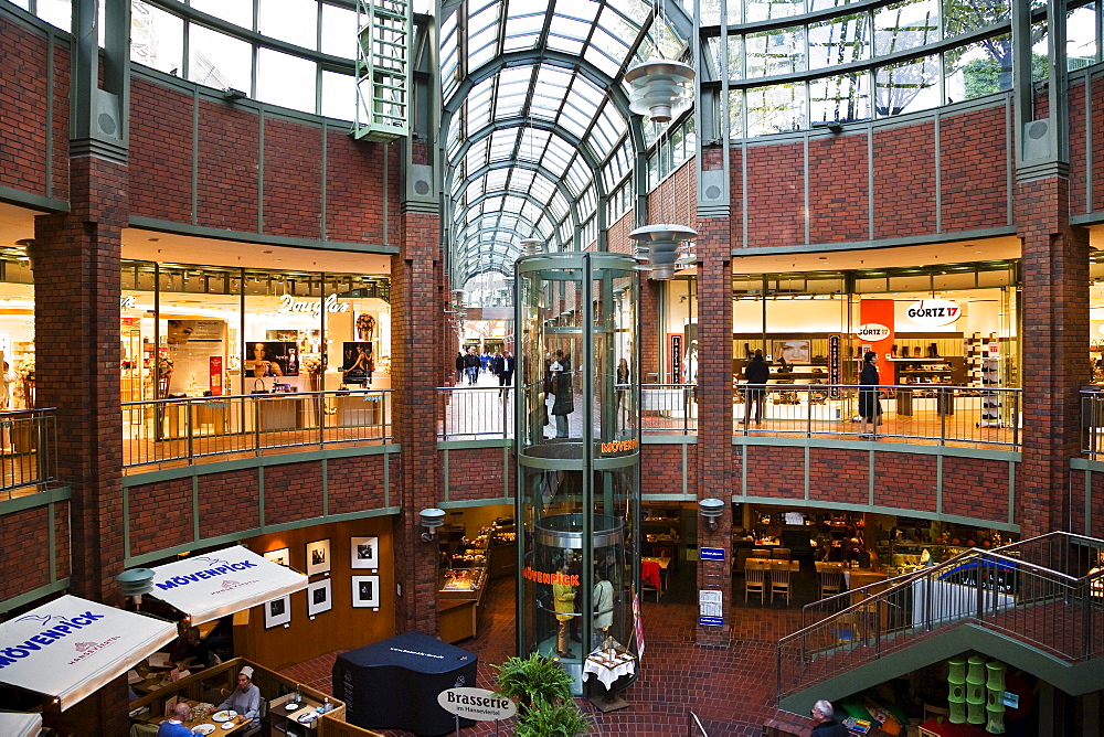 Illuminated shops at a shopping center, Hanse Viertel, Hamburg, Germany, Europe