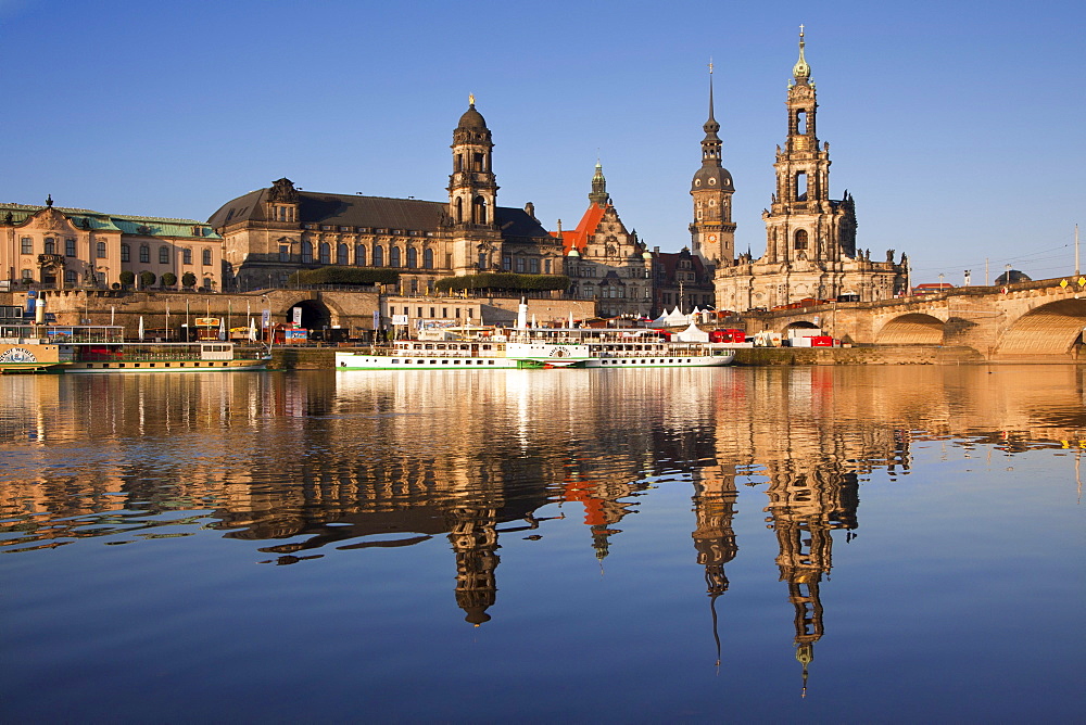 View over the Elbe river to Bruehlsche Terrasse, Staendehaus, Dresden castle and church Hofkirche in the evening light, Dresden, Saxonia, Germany