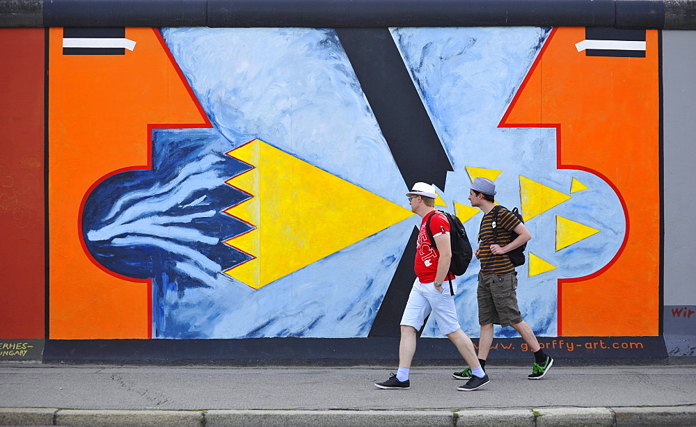 People in front of a painting of the East Side Gallery, Berliner Mauer, Muehlenstrasse, Berlin, Germany, Europe