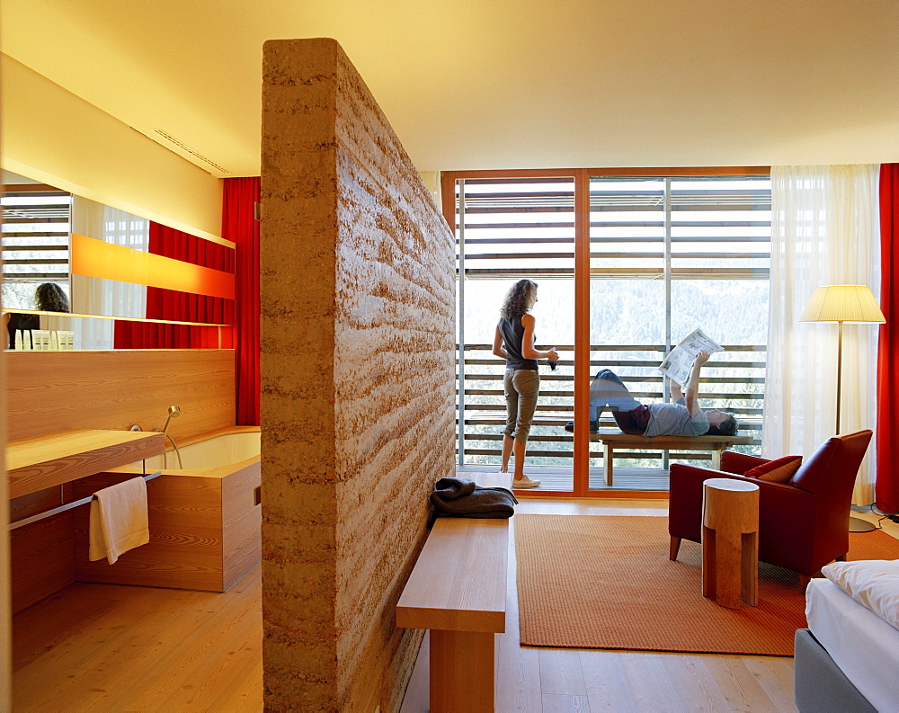 Couple on a balcony of a hotel room, Vigilius Mountain Resort, Vigiljoch, Lana, Trentino-Alto Adige/Suedtirol, Italy