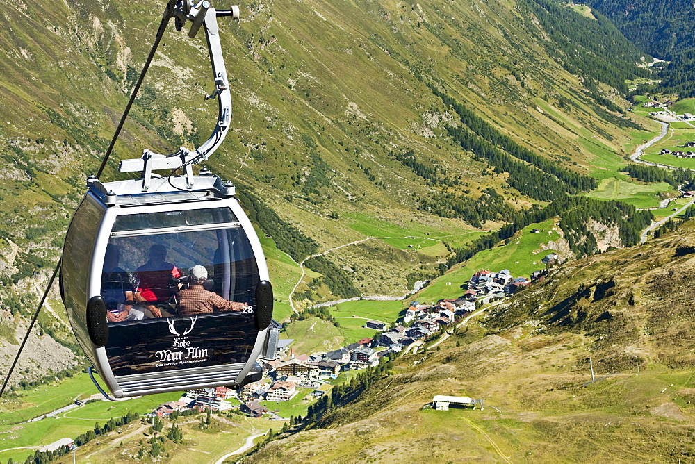 People in a passenger cabin above a valley, Obergurgl, Oetztal Alps, Tyrol, Austria, Europe