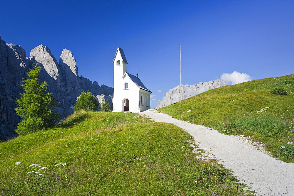 Chapel in the sunlight in front of Dolomites, Groedner Joch, Sella, South Tyrol, Alto Adige, Italy, Europe